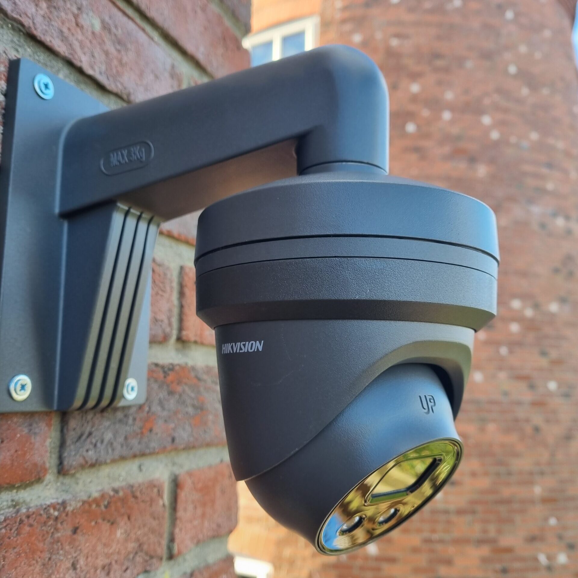 Grey CCTV camera installed on a wall