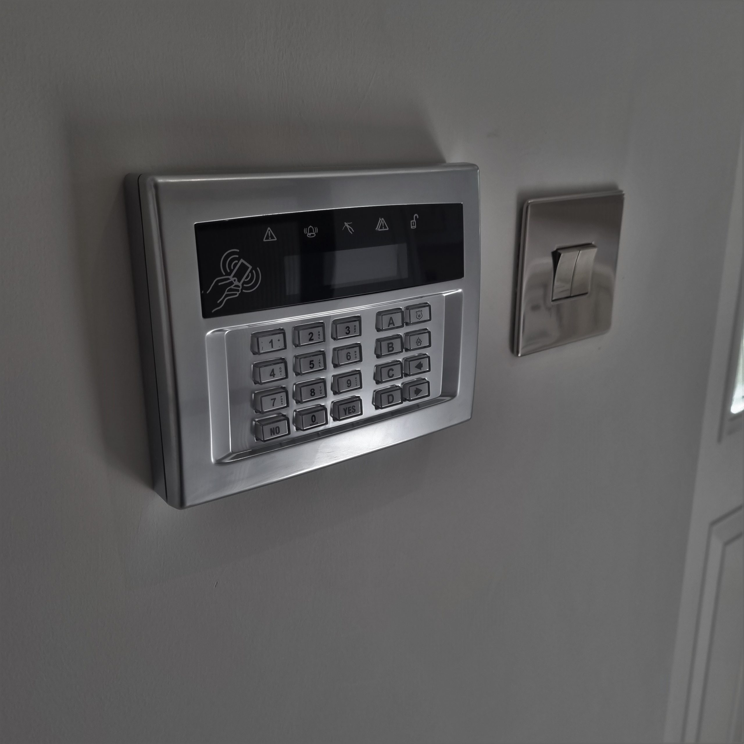 A chrome Flush mounted keypad for the intruder alarm system